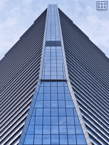 A colorful architectural photo of the facade of 10 Hudson Yards in New York City seen from an upward-looking perspective. Large-scale framed prints of this photo are available up to 80 inches in height.