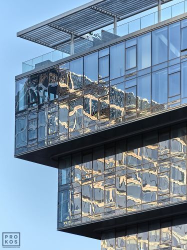 An architectural photo capturing warped reflections on the cantilevered facade of 100 Norfolk Street, in New York City's Lower East Side by architecture firm ODA. Limited edition fine art prints of this photo are available up to 72 inches in height and framed in wood, metal and acrylic styles
