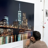 Photographer Andrew Prokos signing a large scale 120 inch limited edition print