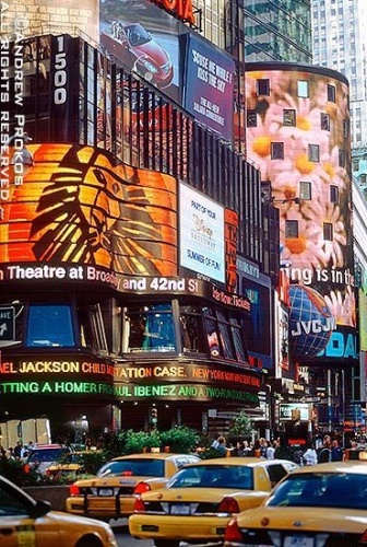 Electric signs and taxi cabs on Broadway in Times Square, New York City