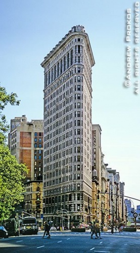 A view of New York City's Flatiron Building from Fifth Avenue during the day
