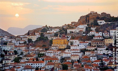 A view of the old stone houses of Hydra Town at sunset, Hydra, Greece