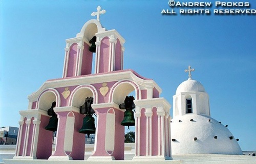 A cycladic style dome and campanile on the island of Santorini, Greece. Fine art prints of this photo are available framed in various styles. 
