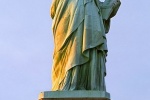 A panoramic photo of the Statue of Liberty at sunset, New York City