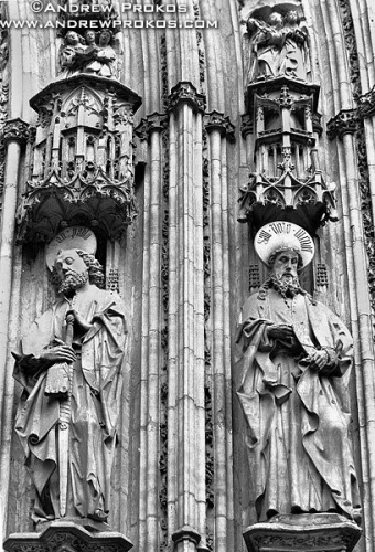 A pair of Gothic saints carved in stone on the portal of Toledo Cathedral, Spain