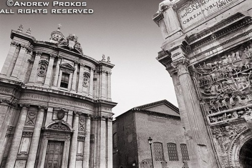 The architecture on the Via dei Fori Imperiali, including the church of Santi Luca e Martina and the Arch of Septimus Severus in the Roman Forum Rome, Italy