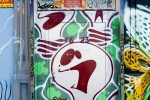 A door painted with graffiti as part of a street mural in New York City. Framed fine art prints of this photo are available in various sizes. 
