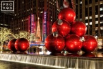 A long-exposure fine art photo of the Christmas decorations along 6th Avenue and Radio City Music Hall at night.