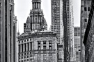New York Architecture - A black and white photograph of the view of 8 Spruce Street (New York by Gehry) and the spire of the Municipal Building in Downtown Manhattan, New York City.