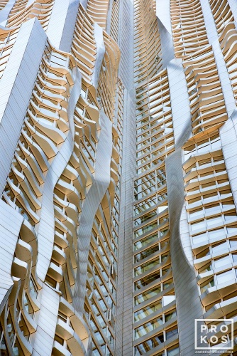 An architectural detail photograph of the warped facade of 8 Spruce Street by Gehry Partners, Manhattan, New York City. Fine art prints of this photo are available framed in various styles. 