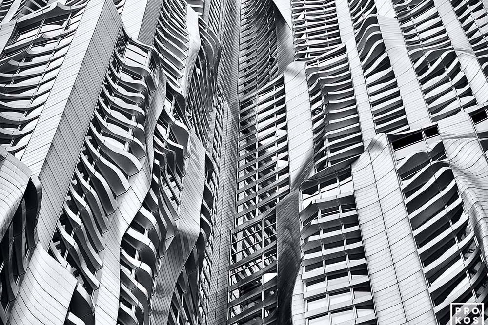 A black and white close-up architectural detail of the contemporary facade of New York by Gehry tower in Manhattan. Limited edition prints of this photo are available framed in various styles.