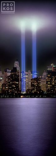 A vertical panoramic view of the Towers of Light memorial in Lower Manhattan, New York City.