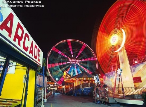 Rides in motion at Coney Island's arcade at night, Brooklyn, New York