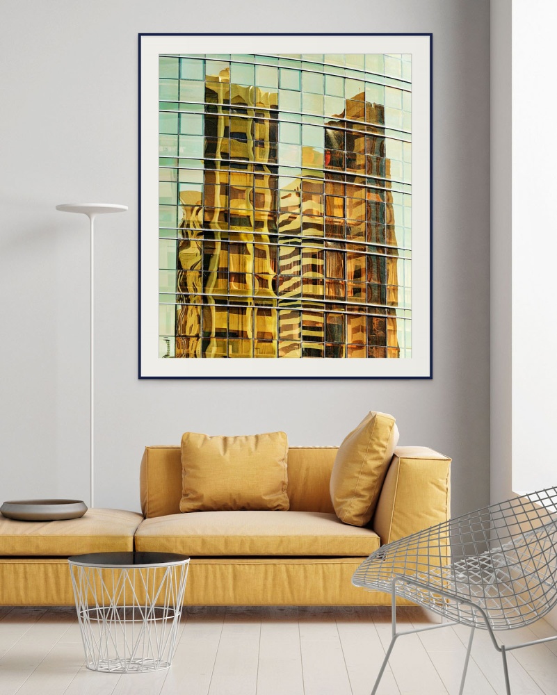 A large-format framed photography print of Abu Dhabi Tower Reflections by abstract photographer Andrew Prokos