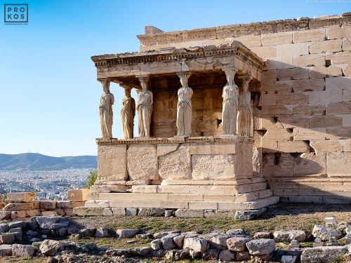 A high-definition fine art photograph of the Porch of the Caryatids from the Erechtheion, show in situ on the Acropolis in Athens, Greece