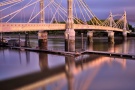 A view of the Albert Bridge and River Thames in London, captured with a four minute long exposure at dusk.