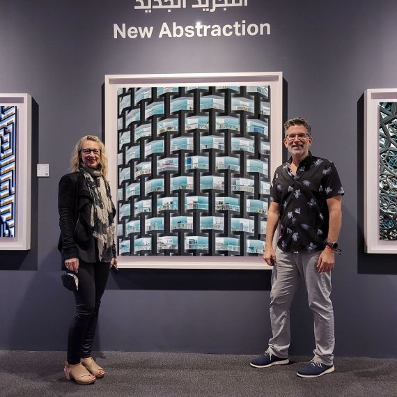 Photographers Andrew Prokos and Debi Cornwall pictured with large-scale photographs from the series 'Inverted' at Prokos's solo exhibition 'New Abstraction', Xposure Photo Festival.