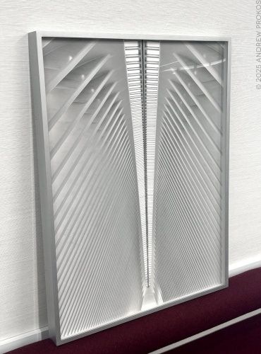 A framed photo of Oculus Interior #1 by fine art photographer Andrew Prokos being prepared for installation in the offices of a London financial services firm.