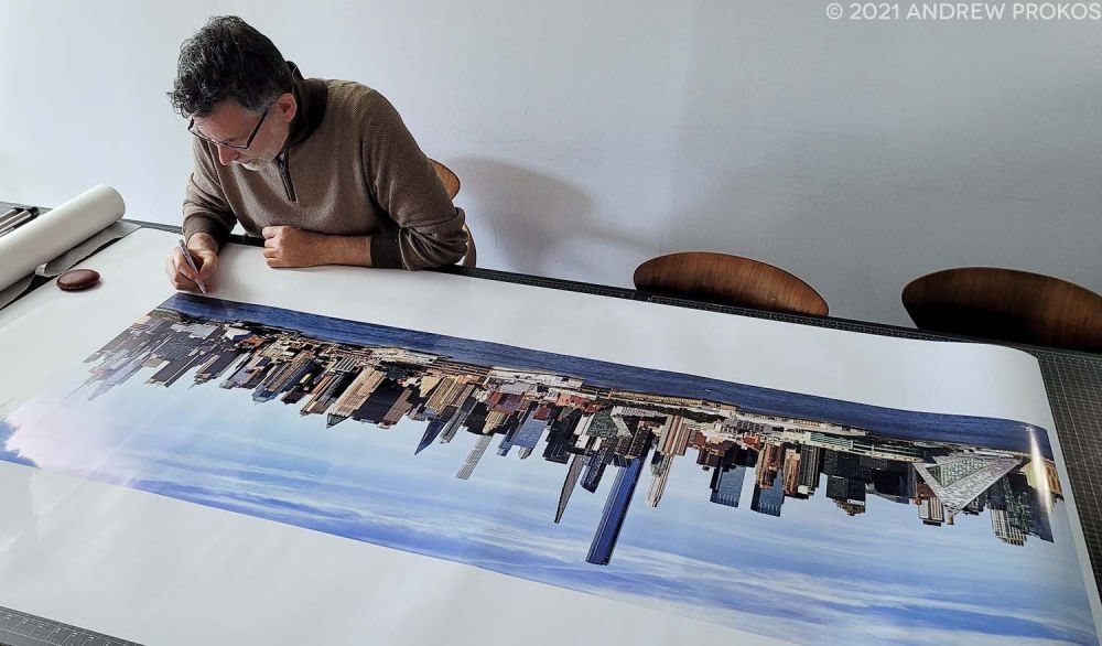 Photographer Andrew Prokos Signing a Large-Format Fine Art Print of 'Panoramic View of Midtown Manhattan from Weehawken'