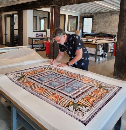 Photographer Andrew Prokos signing large-format Washington DC architectural prints.