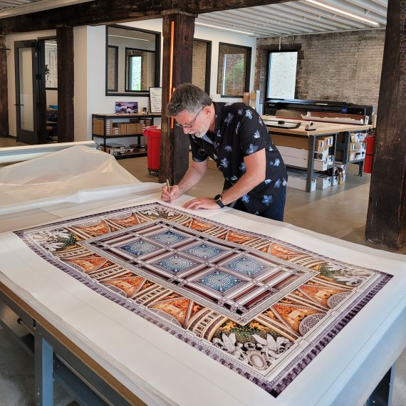 Photographer Andrew Prokos signing large-format Washington DC architectural prints.