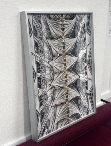 A framed limited edition print of "Sanctuary of Light - Westminster Abbey Interior #1" by fine art photographer Andrew Prokos being prepared for installation in the offices of a London financial services firm.