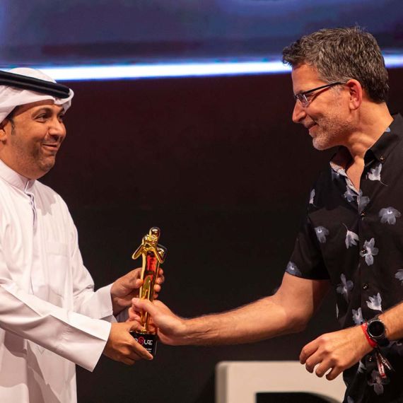 Photographer Andrew Prokos receiving an award at the 2022 Xposure Photo Festival in Sharjah, UAE