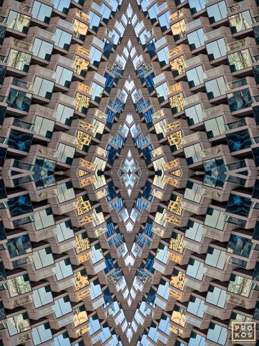 An abstract fine art photograph capturing the concentric levels of glass windows and multicolored reflections from a modern building facade in Dubai, United Arab Emirates. Large-scale limited edition prints of this photo are available up to 96 inches in width. 