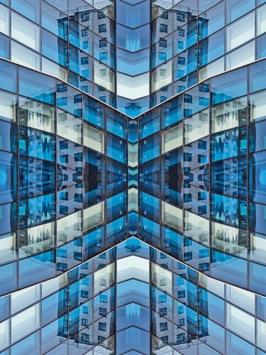 A photograph capturing the repeated shapes and patterns of a brick architectural facade in New York City in tones of brick and metallic grey. Large-scale limited edition prints of this photo are available up to 80 inches.