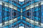 A photograph capturing the repeated shapes and patterns of a brick architectural facade in New York City in tones of brick and metallic grey. Large-scale limited edition prints of this photo are available up to 80 inches.