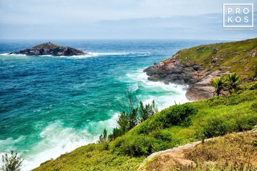A landscape photo showing the cliffs of Arraial do Cabo, Brazil and the Atlantic Ocean.