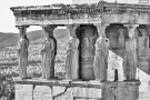 A black and white photograph of the famed caryatids from the Porch of the Maidens in the Erechtheion on the Acropolis in Athens, Greece