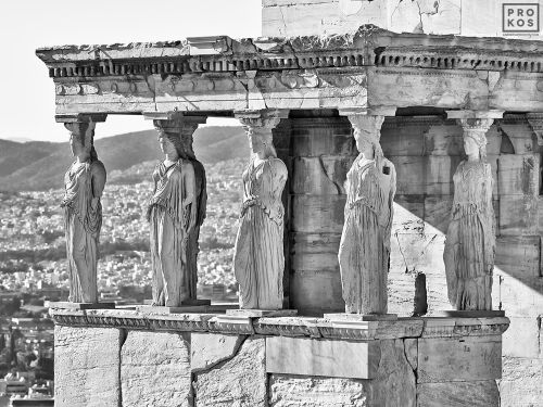 A black and white photograph of the famed caryatids from the Porch of the Maidens in the Erechtheion on the Acropolis in Athens, Greece