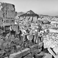 A black and white photograph of the view of Athens's famed Lykabettus Hill as seen from the Acropolis, Greece