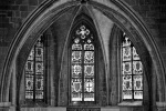 A black and white gothic interior with stained glass windows in the Gothic Quarter of Barcelona, Spain