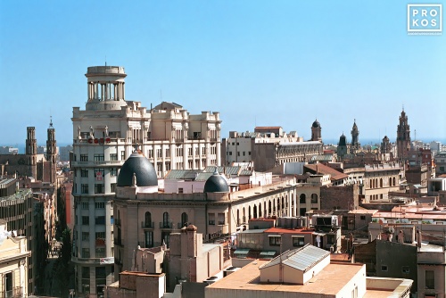 A view of the rooftops of Barcelona, Spain looking toward the sea. Fine art prints of this photo are available framed in various styles, please inquire.