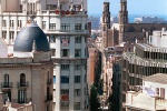 A view of the rooftops of the Ribera district of Barcelona, Spain along with the spires of the gothic church Santa Maria del Mar. Fine art prints of this photo are available framed in various styles. 