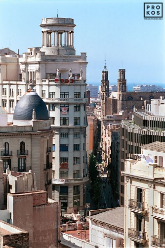 A view of the rooftops of the Ribera district of Barcelona, Spain along with the spires of the gothic church Santa Maria del Mar. Fine art prints of this photo are available framed in various styles. 