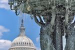 A view of the Victorian era Bartholdi Fountain in Washington DC, with the US Capitol in the distance.