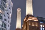 A view of the facade and smokestacks of Battersea Power Station at night, London, United Kingdom. High-definition fine art prints of this photo are available up to 72 inches in height.