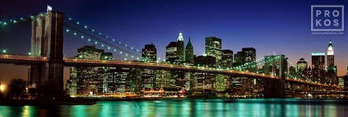 A high-definition panoramic skyline photo of the Brooklyn Bridge and Lower Manhattan at night, New York City
