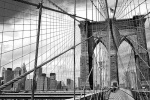 A black and white panoramic photo of the Brooklyn Bridge and its famous suspension cables, New York City