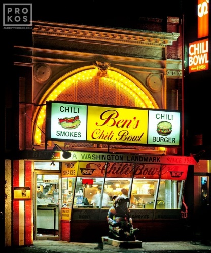 A street scene photo of Ben's Chili Bowl restaurant at night, Washington DC