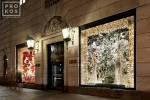 A street scene of a couple looking at the Christmas windows at Bergdorf Goodman on New York's Fifth Avenue at night. Limited edition fine art prints of this photo are available up to 50 inches in width and framed in various wood, metal and acrylic styles. 