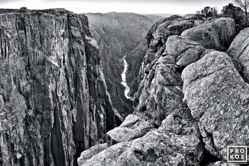 A dramatic black and white landscape from Black Canyon of the Gunnison River National Park in Colorado. Black Canyon is the steepest canyon in North America. Large format fine art prints of this photo are available framed in various styles.