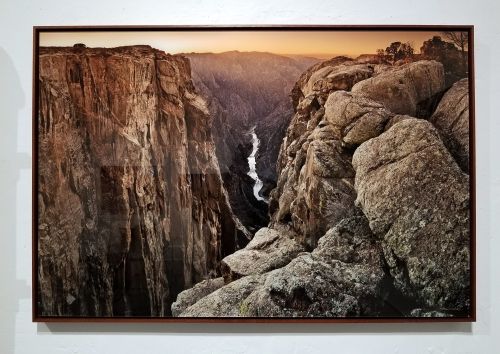 A 50 inch limited edition print of 'Black Canyon Sunset' by photographer Andrew Prokos with a walnut and acrylic floater frame