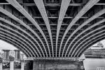 A black and white photo of the underspan of Blackfriars Bridge and the Thames River in London captured with a four minute long exposure time. Limited edition fine art prints of this photo are available up to 80 inches in width and framed in various wood, metal, and acrylic styles.