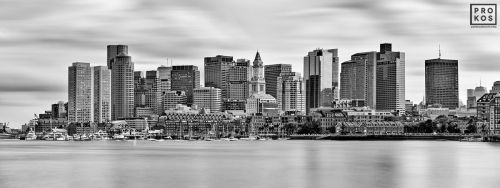 A black and white high-definition skyline of Boston, Massachusetts captured with a six minute long-exposure time by photographer Andrew Prokos