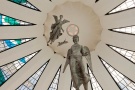 An architectural interior photo of the Cathedral of Brasilia with suspended angel statues