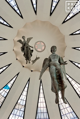 An architectural interior photo of the Cathedral of Brasilia with suspended angel statues